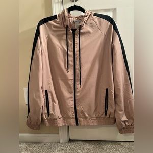 Nude windbreaker with black and white stripe on sleeves